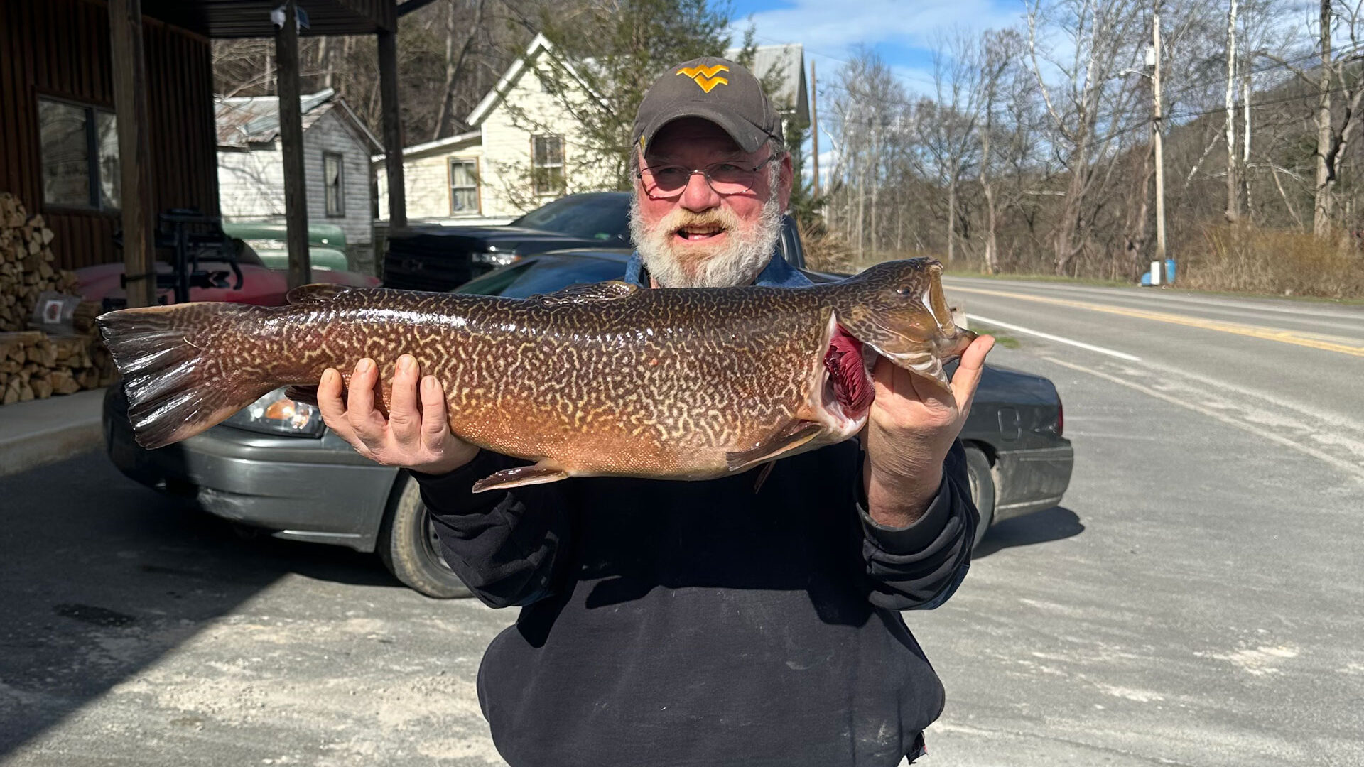 John Terry holds a 29.13-inch, 11.04-pound tiger trout