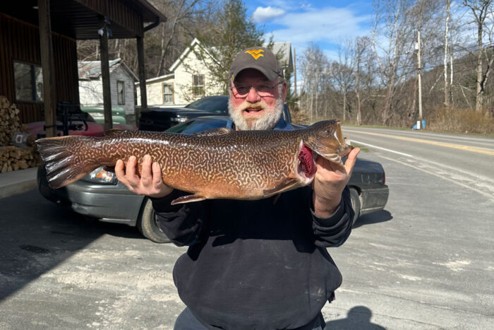 John Terry holds a 29.13-inch, 11.04-pound tiger trout